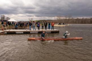 Two 俄亥俄州 University engineering students paddle in a concrete canoe they built